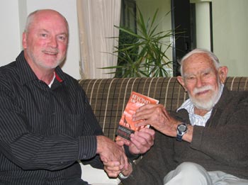 Frank presents a copy of Beyond Mombasa to 96-year-old Brian Goord.